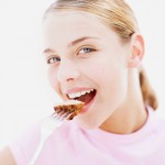 Girl Eating A Piece Of Steak